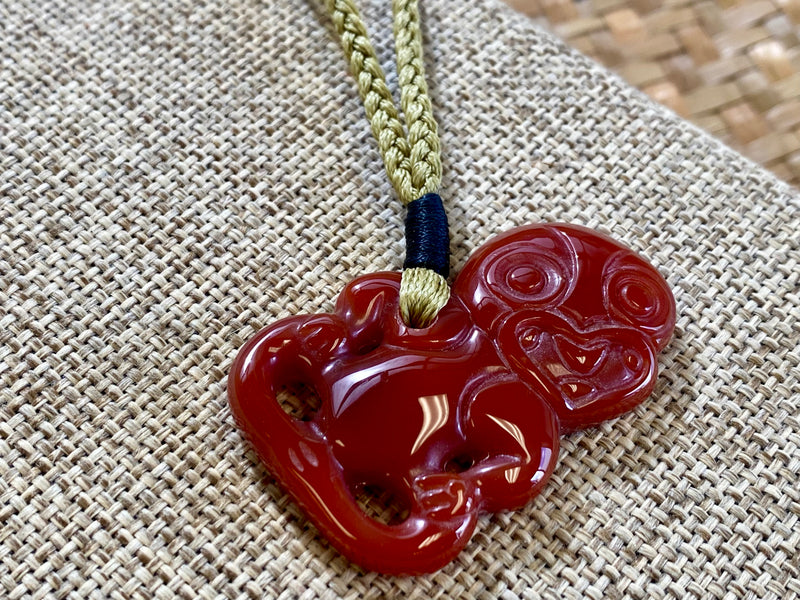 Gemstone Heitiki necklaces on woven cord