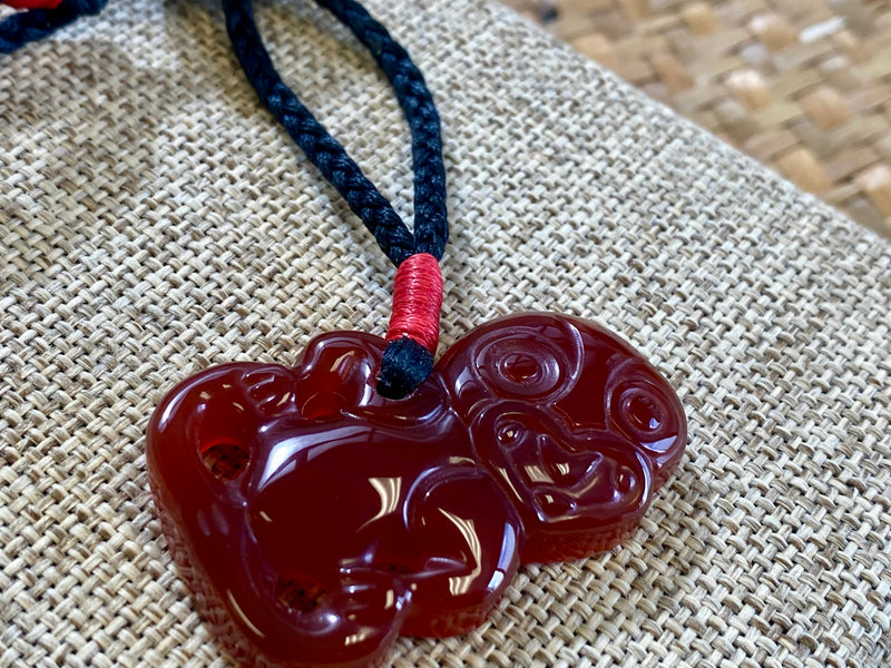 Gemstone Heitiki necklaces on woven cord