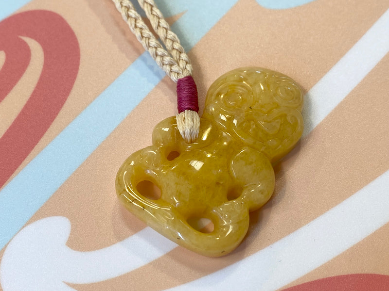 Gemstone Heitiki necklaces on woven cord