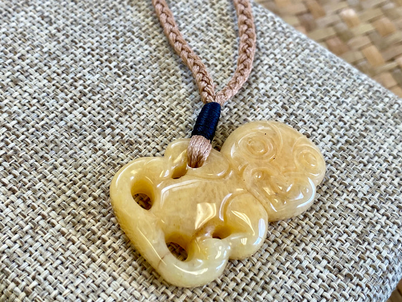 Gemstone Heitiki necklaces on woven cord