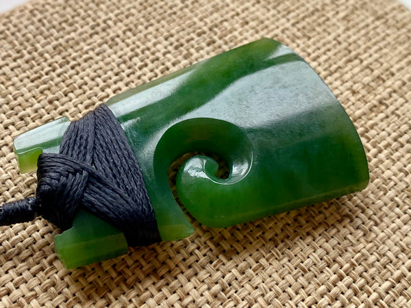 NZ Pounamu Toki pendant with koru